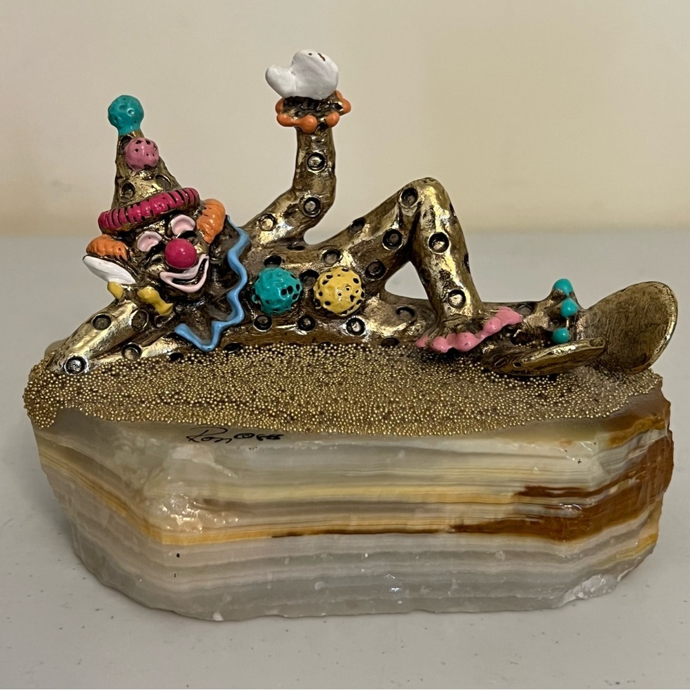 Ron Lee “Clown Pinky Laying Down” on Onyx Marble